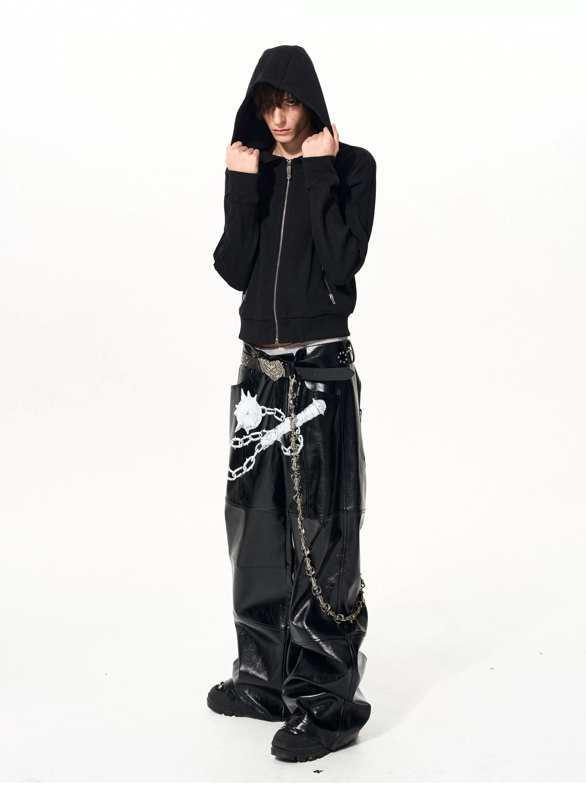 Hood-up styling of black zip hoodie from the front