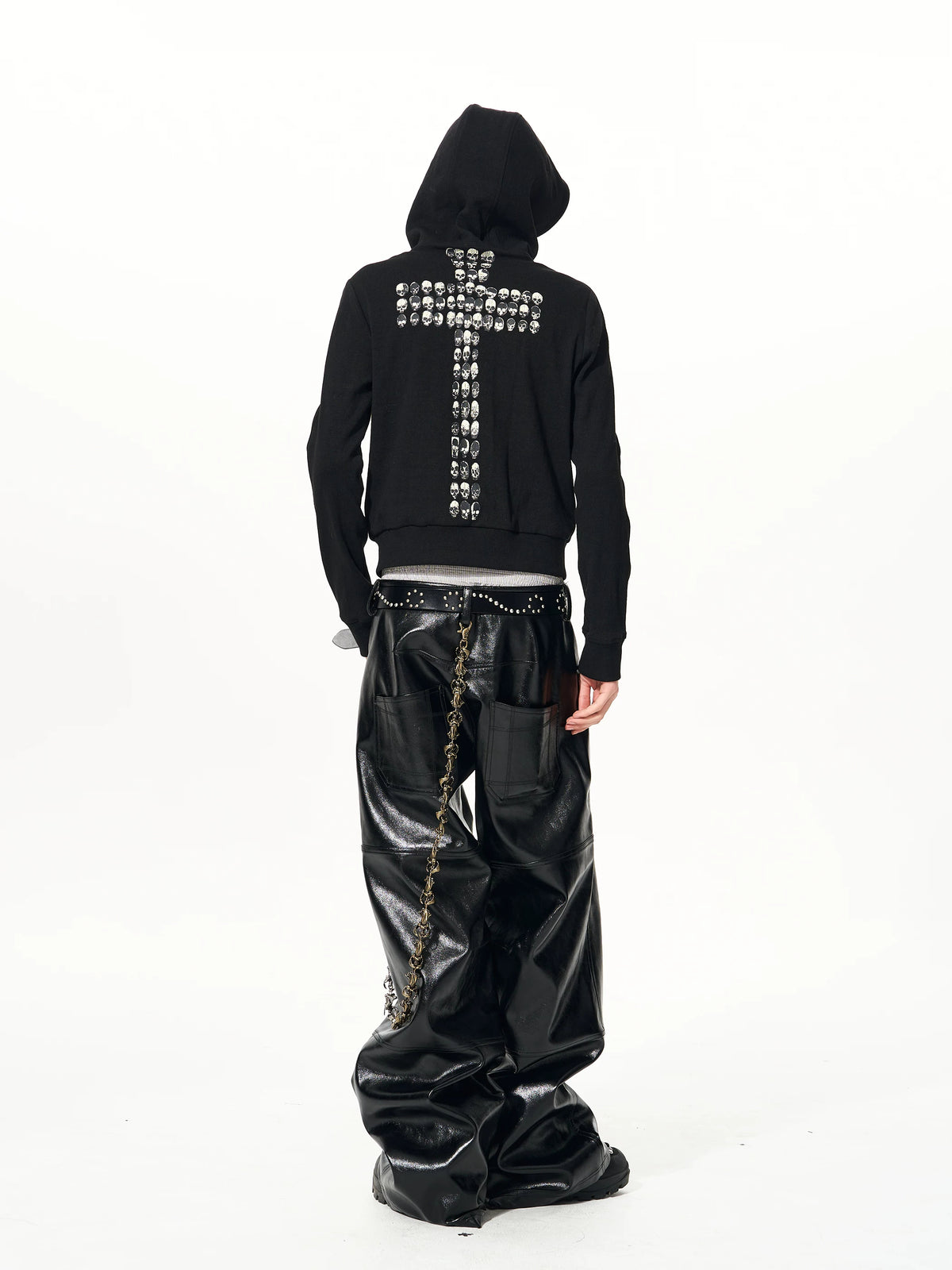 Rear angled view of black skull-cross hoodie